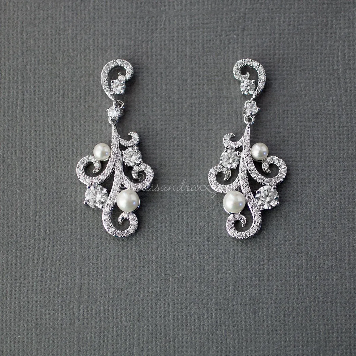 Pearl CZ Earrings with a Swirl Design